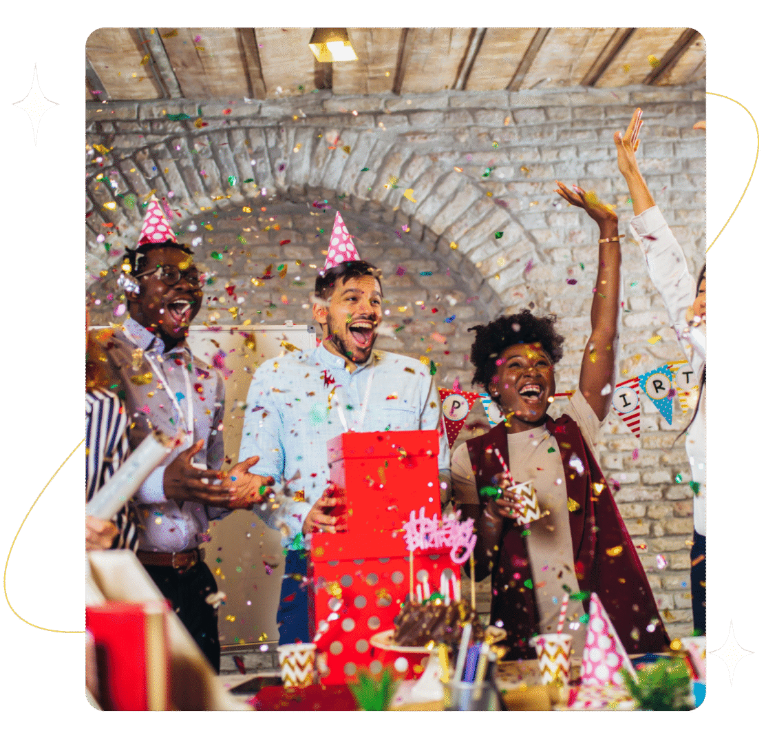 People celebrating a birthday with confetti.