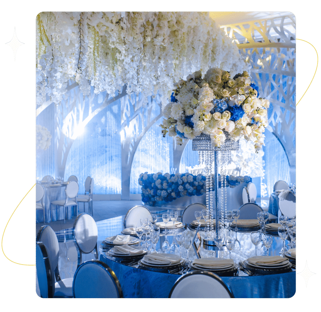 Elegant wedding reception with blue and white decor.